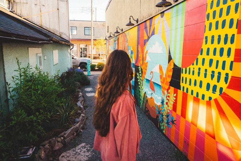 Woman exploring downtown Duncan mural